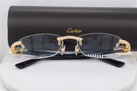 gold cartier glasses with diamonds.